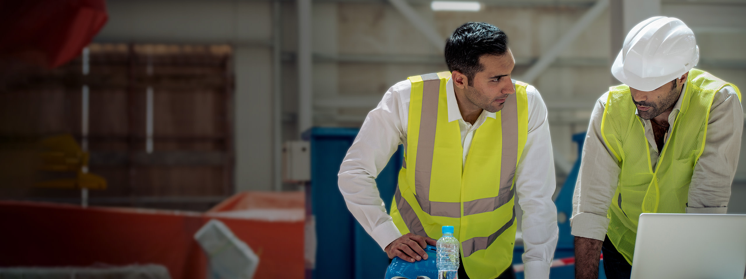 Contractors reviewing the site's info on a tablet