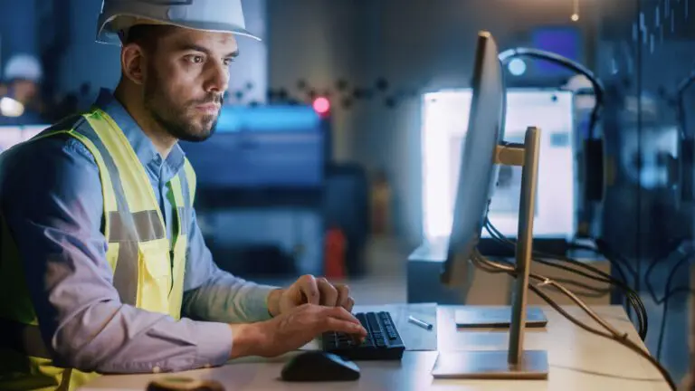 worker at computer in jobsite office